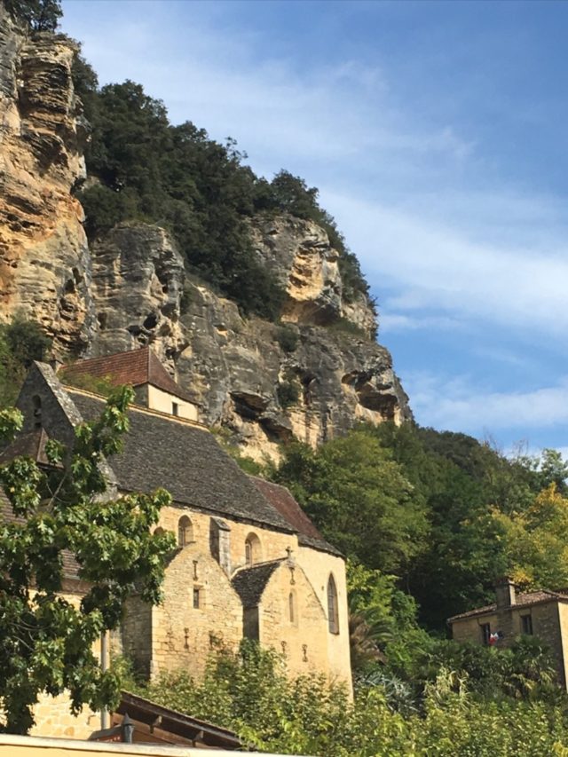 A church nestled into the limestone cliffs, part of the beautiful village of La Roque-Gageac on the Dordogne River where we will stay.